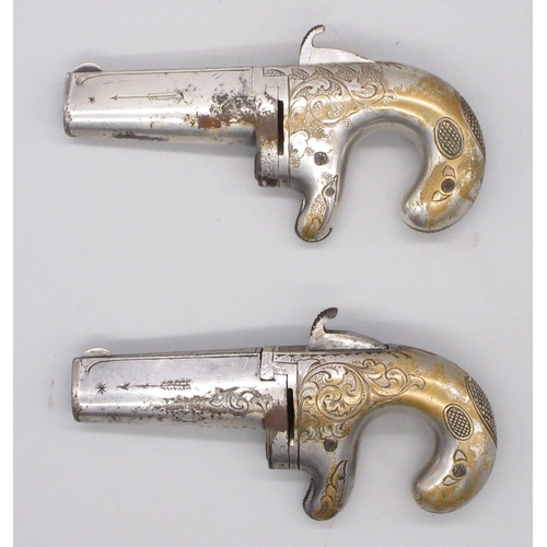 24 - Cased matched pair of Moores Patent .41 rimfire Derringer pistols, nickel plated with scroll engravi... 