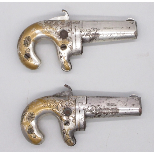 24 - Cased matched pair of Moores Patent .41 rimfire Derringer pistols, nickel plated with scroll engravi... 