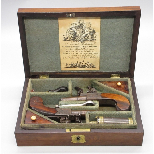 Cased pair of flintlock pocket pistols with folding triggers by Brunn London, 1.25" turn-off barrels with engraved muzzles and proof marks,  named locks, top slide safety's, chequered grip backs, 14cm overall, in fitted mahogany case with trade label and accessories, 23x15.5x6cm

Shipping £33.00 plus vat (UK Only)