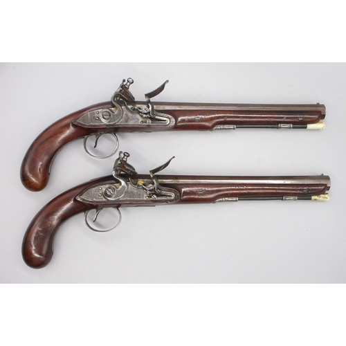 Pair of Irish 18 bore flintlock duelling pistols by `Rainsford Dublin', 10" octagonal barrels with stamped proof marks. fixed fore and aft sights, engraved `Dublin', named locks and gilt touch holes, 39cm overall

Shipping £38.00 plus vat (UK Only)