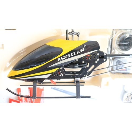 33 - Three large scale radio controlled models to include two helicopters, a Copter X450 in metal flight ... 