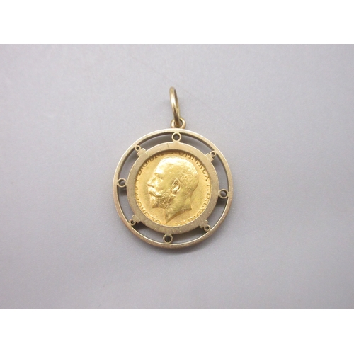 8 - George V (1910-1936) 1911 Sovereign in yellow metal mount (13.5g)

Bradley's shipping £20.00 plus va... 
