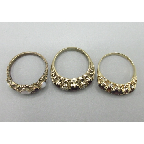 5 - 9ct yellow gold seven stone garnet ring, stamped 375, size N, 9ct yellow gold garnet and clear stone... 