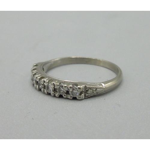 37 - 18ct white gold half eternity ring set with diamonds, stamped 750, size L, 2.2g

Bradley's Shipping ... 