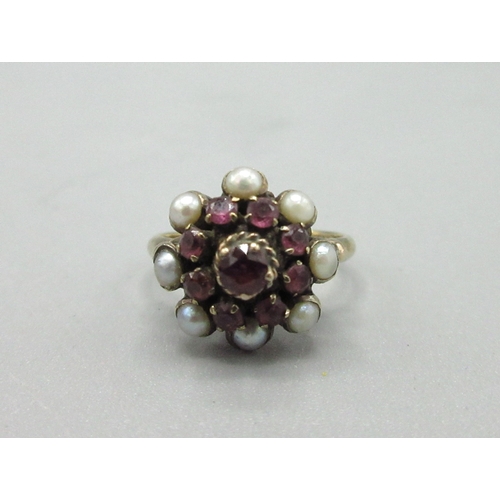 57 - 14ct yellow gold cluster ring set with rubies and pearls, stamped 14K, size K1/2, 3.2g

Bradley's Sh... 