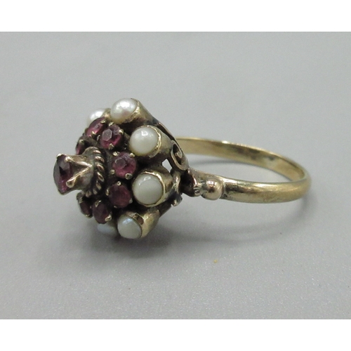 57 - 14ct yellow gold cluster ring set with rubies and pearls, stamped 14K, size K1/2, 3.2g

Bradley's Sh... 