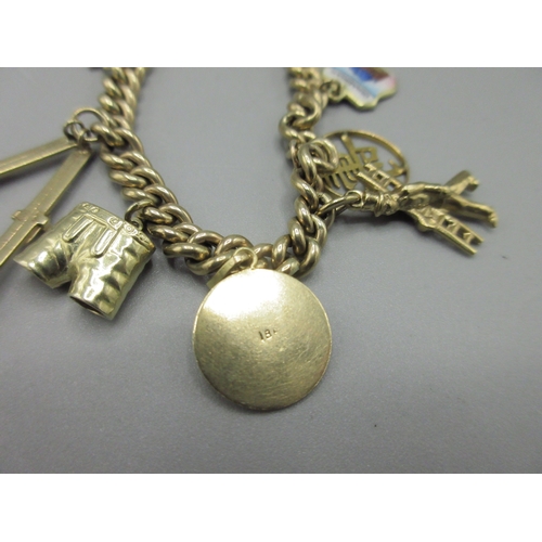58 - 8ct yellow gold charm bracelet, stamped 333, with a selection of charms stamped at 14ct, 18ct or unm... 
