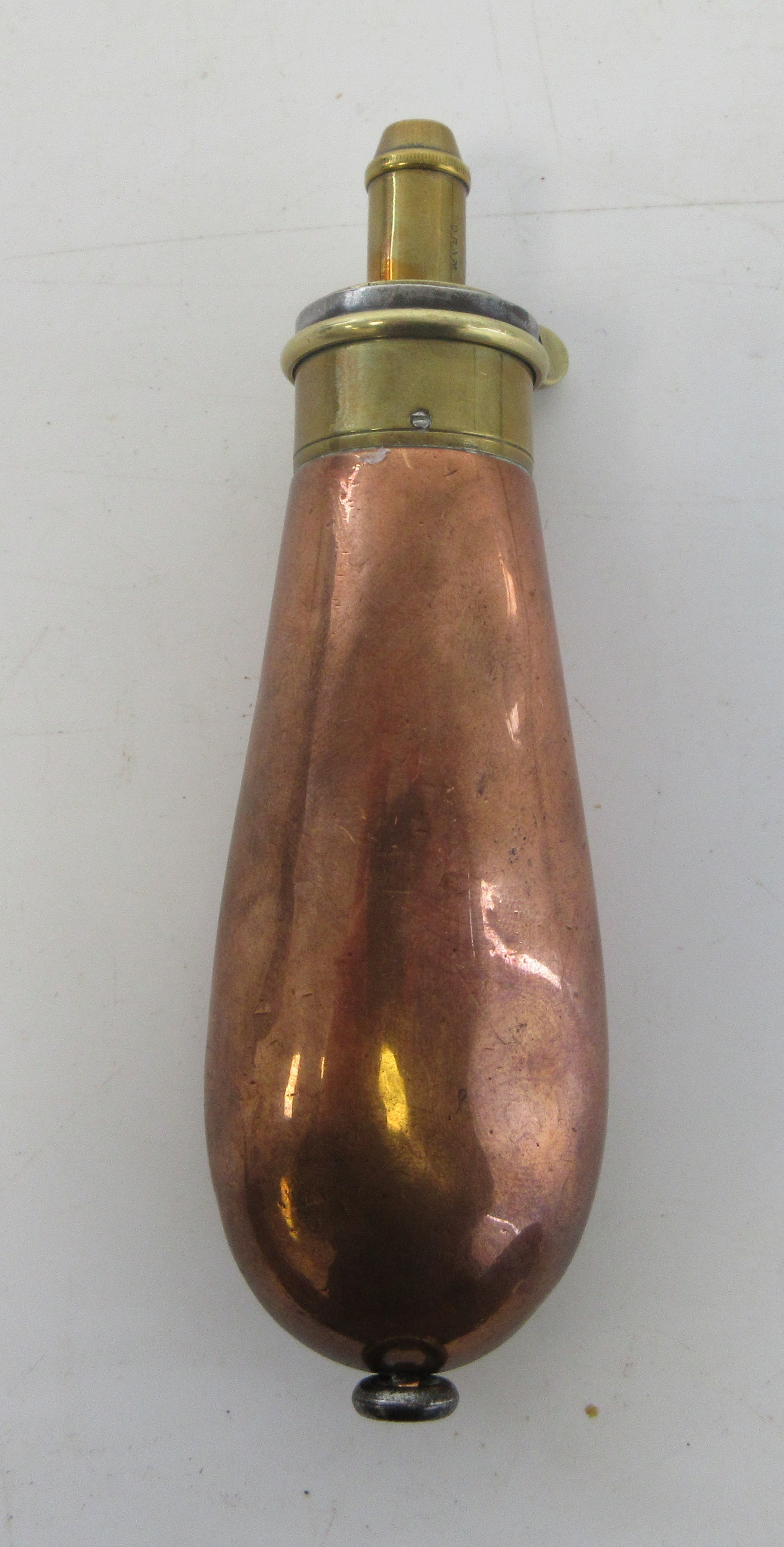 Copper revolver powder flask, stamped 