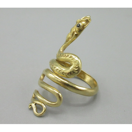 1020 - 18ct yellow gold snake ring set with sapphire eyes, stamped 750, size K, 7.6g

Bradleys shipping £23... 