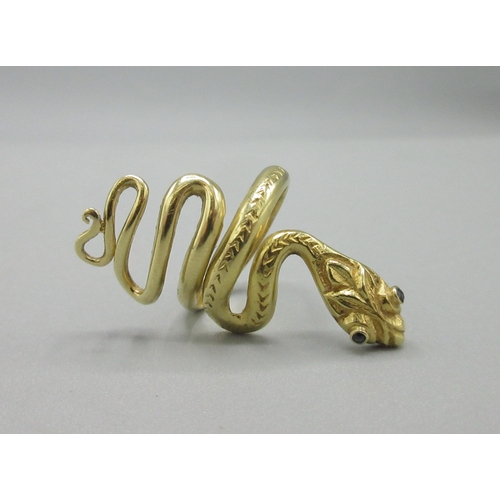 1020 - 18ct yellow gold snake ring set with sapphire eyes, stamped 750, size K, 7.6g

Bradleys shipping £23... 