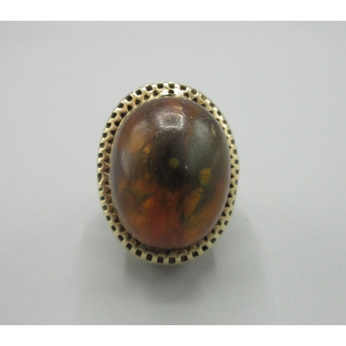1017 - 9ct yellow gold cocktail ring set with large amber stone, stamped 750, size L, 10.7g

Bradleys shipp... 