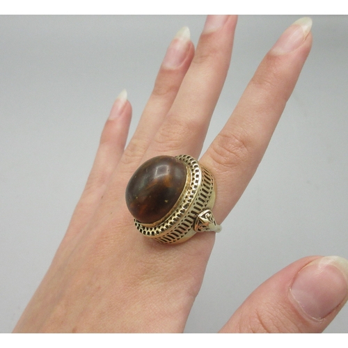 1017 - 9ct yellow gold cocktail ring set with large amber stone, stamped 750, size L, 10.7g

Bradleys shipp... 