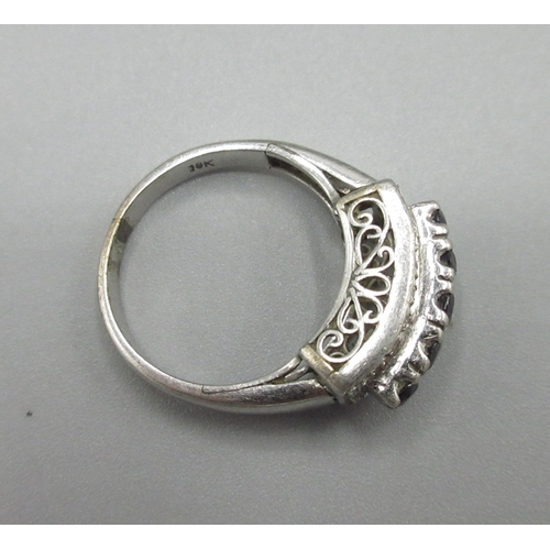 1033 - 18ct white gold ring set with diamonds and a raised row of sapphires, stamped 18k, size M1/2, 4.8g

... 