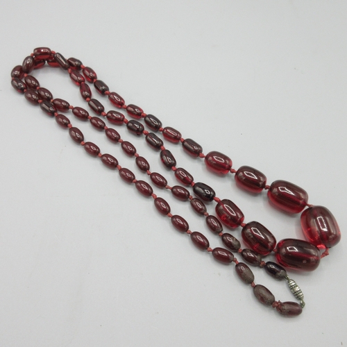 1039 - Cherry amber graduated bead necklace, strung knotted, approximate L110, largest bead 25mm

Bradleys ... 