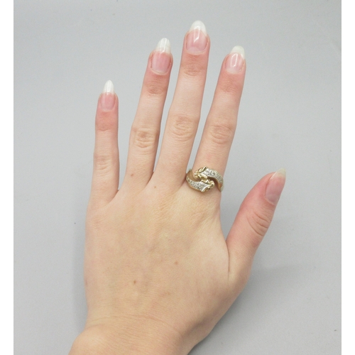 1054 - 9ct yellow gold panther ring, crossover head set with ruby eyes and diamond backs, stamped 375, size... 