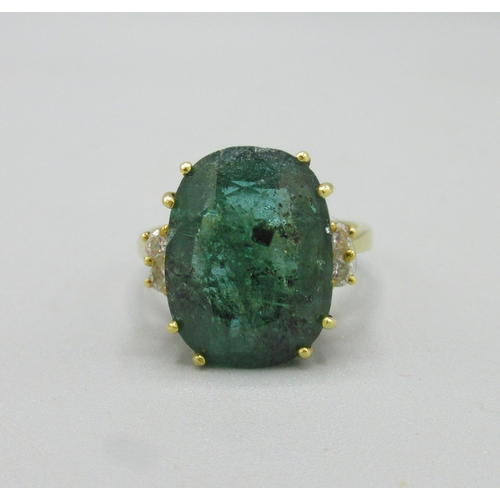 1013 - 20th century 18ct yellow gold ring set with large cushion cut emerald flanked by two diamonds, emera... 
