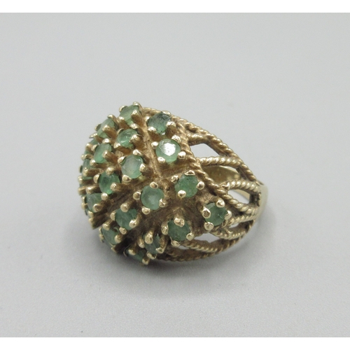 1044 - 9ct yellow gold cocktail cluster ring set with emerald, stamped 375, size N, 7.6g

Bradleys shipping... 