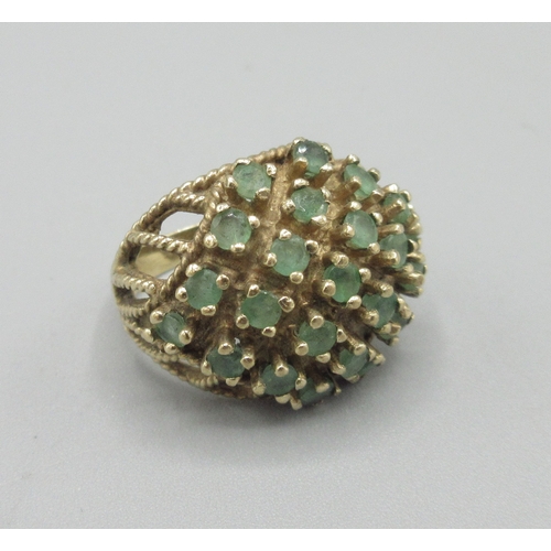 1044 - 9ct yellow gold cocktail cluster ring set with emerald, stamped 375, size N, 7.6g

Bradleys shipping... 