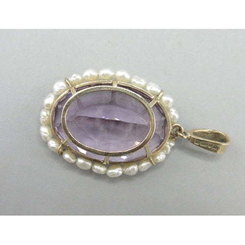 1053 - 9ct yellow gold amethyst and fresh water pearl pendant, large oval amethyst encircled by pearls, L5c... 