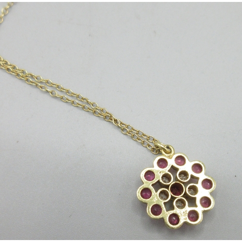 1023 - 18ct yellow gold necklace, flower pendant set with diamonds and rubies, chain and pendant stamped 75... 