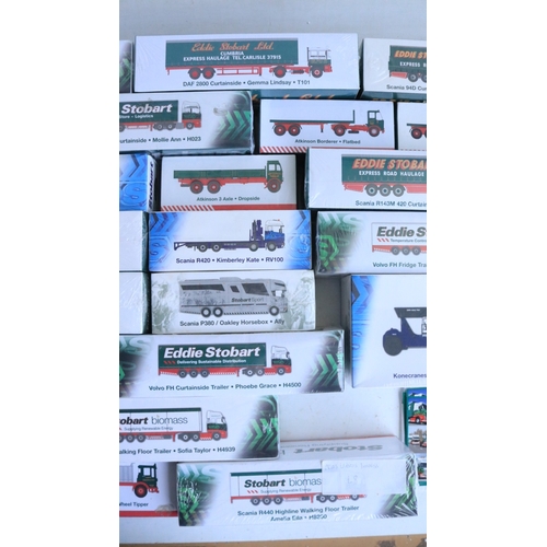 Thirty two 1/76 scale Eddie Stobart themed diecast model trucks and ...