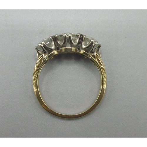 1002 - 18ct yellow gold trilogy ring, three round brilliant cut diamonds in claw setting, central diamond a... 