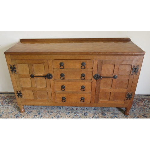 Sid Pollard of Thirsk - a panelled adzed oak sideboard, with upstand above four short drawers enclosed by two six panel doors, with Moorside Wrought Iron hinges latches and handles, W138cm D47cm H84cm. Provenance; From the Estate of Joyce & Mike Hammond, Moorside Wrought Iron who produced the metal handles and latches for most of the Yorkshire Critters

 

Bradleys shipping POA https://www.bradleys.ltd/quotation-request-form
