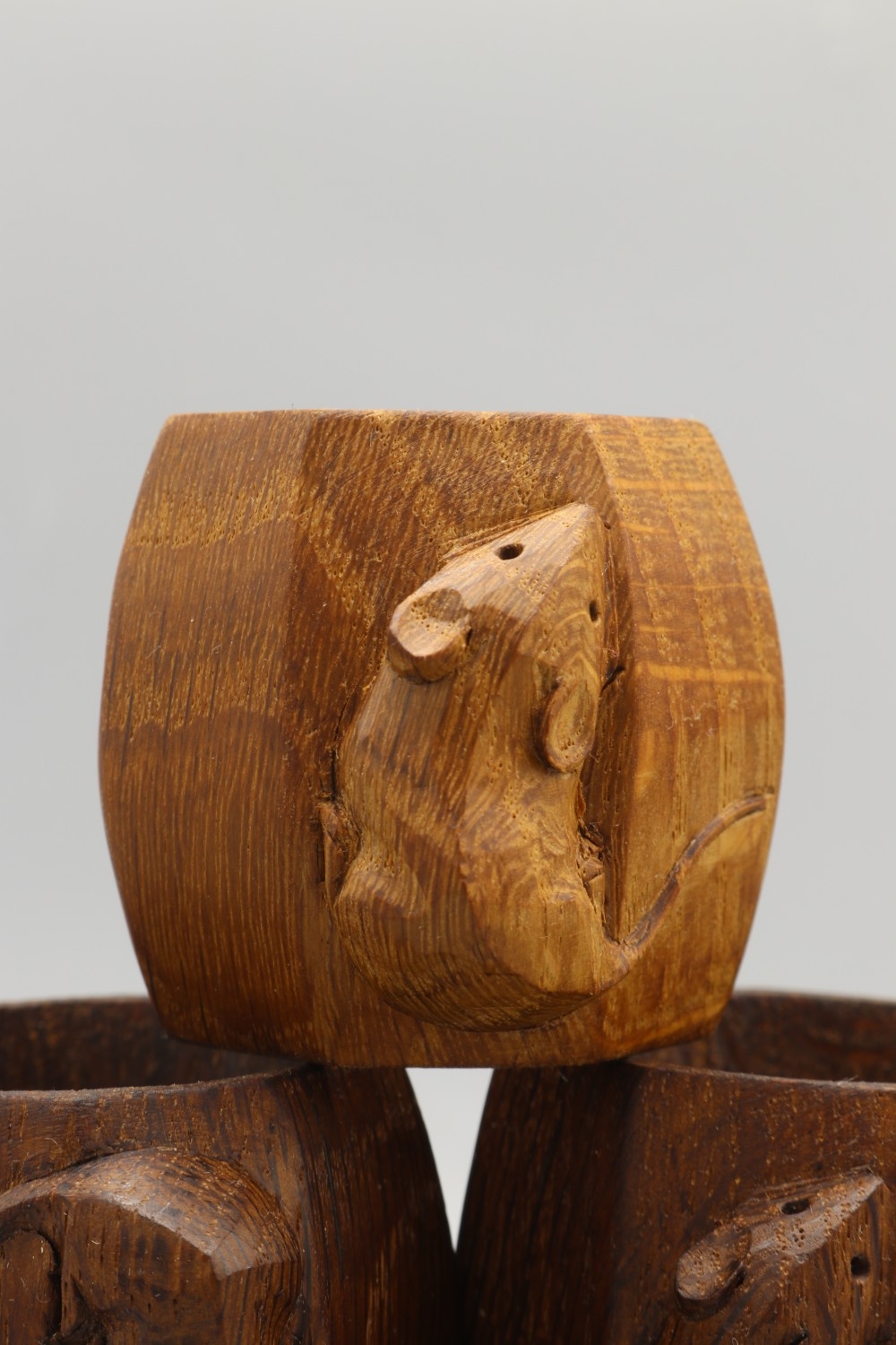 Robert Mouseman Thompson of Kilburn - six oak octagonal napkin rings ...