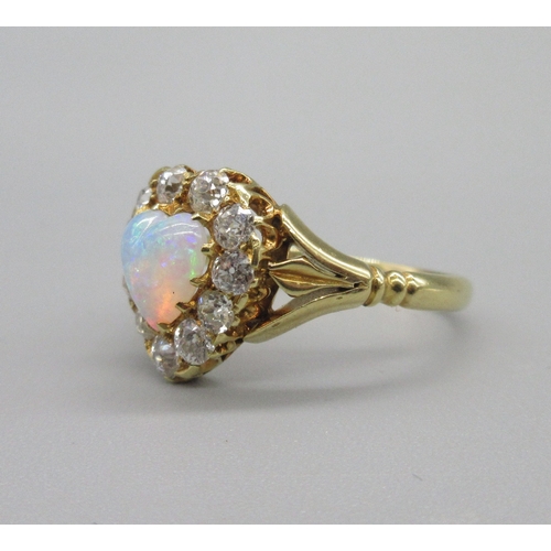 1019 - 18ct yellow gold opal and diamond ring, heart shaped cabochon opal surrounded with a halo of old cut... 