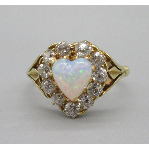 1019 - 18ct yellow gold opal and diamond ring, heart shaped cabochon opal surrounded with a halo of old cut... 