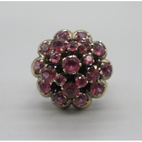 1031 - 18ct yellow gold princess ring set with twenty-one rubies, stamped 18k, size K, 6.6g

Bradleys shipp... 