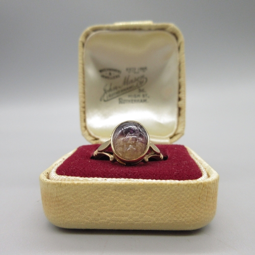 1041 - 9ct rose gold ring set with oval cabochon blue john stone, stamped 375, size Q, 3.1g

Bradleys shipp... 