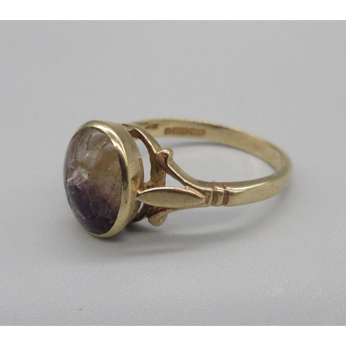 1041 - 9ct rose gold ring set with oval cabochon blue john stone, stamped 375, size Q, 3.1g

Bradleys shipp... 