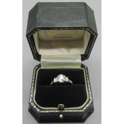 1010 - Platinum diamond ring, central old European cut diamond approximately 1 carat, flanked by baguette c... 