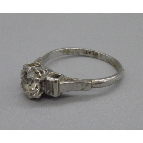 1010 - Platinum diamond ring, central old European cut diamond approximately 1 carat, flanked by baguette c... 