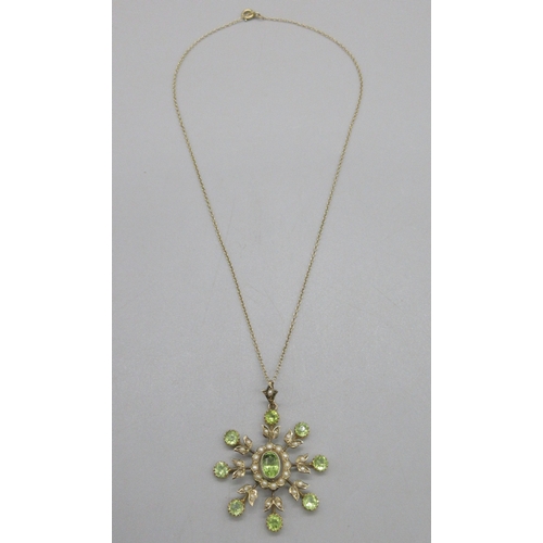 1049 - Edwardian 9ct yellow gold pendant set with a spray of peridot stones and seed pearls, on a 9ct yello... 