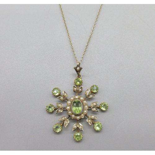 1049 - Edwardian 9ct yellow gold pendant set with a spray of peridot stones and seed pearls, on a 9ct yello... 