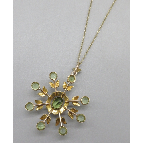 1049 - Edwardian 9ct yellow gold pendant set with a spray of peridot stones and seed pearls, on a 9ct yello... 