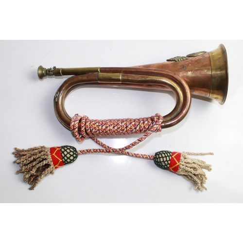 143 - Brass and copper Military bugle with rope 'colours' for the Royal Welsh Fusiliers

Shipping £38.00 p... 