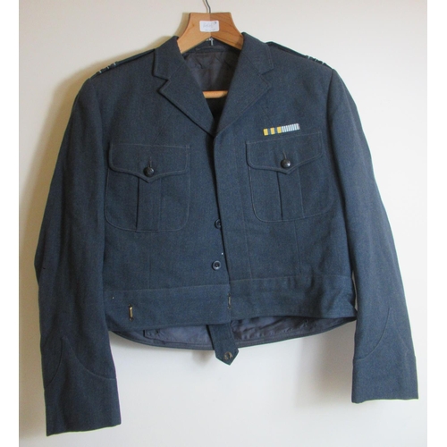 192 - Three circa mid-20th century RAF tunics, W46-49cm, with pair of trousers and cap (4)

Bradleys shipp... 