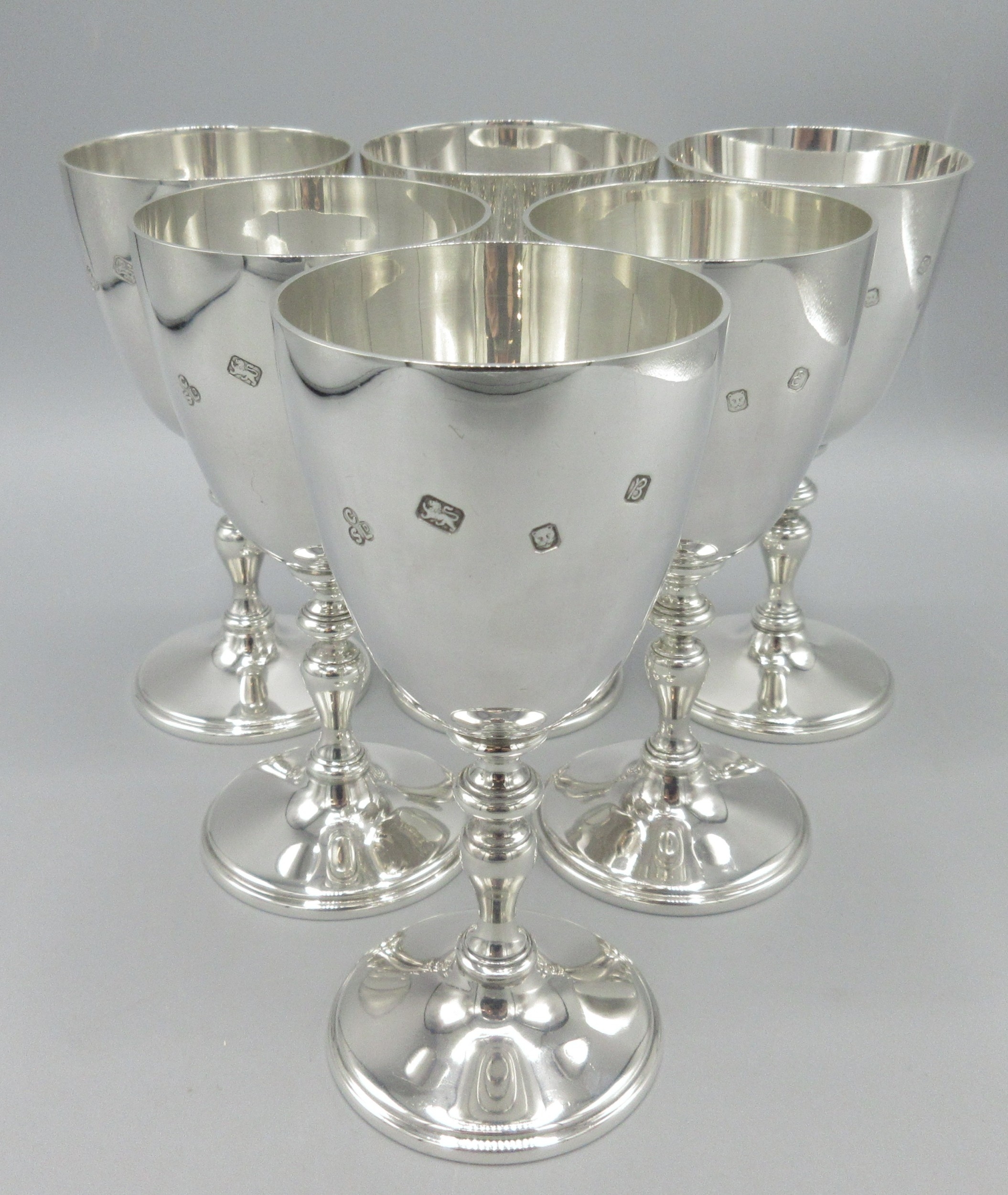 Six 20th century silver goblets with knobbed stems and circular bases ...