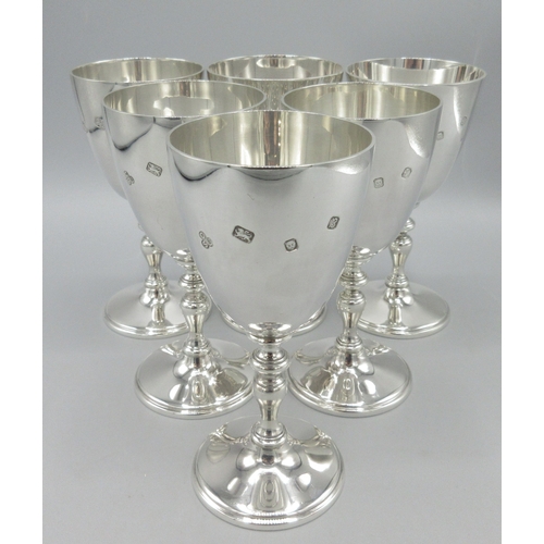 Six 20th century silver goblets with knobbed stems and circular bases, by Courtman Silver Ltd,  London 1979, some varying date letters, 43.4ozt

Bradleys shipping £38.00 plus vat (UK Only)