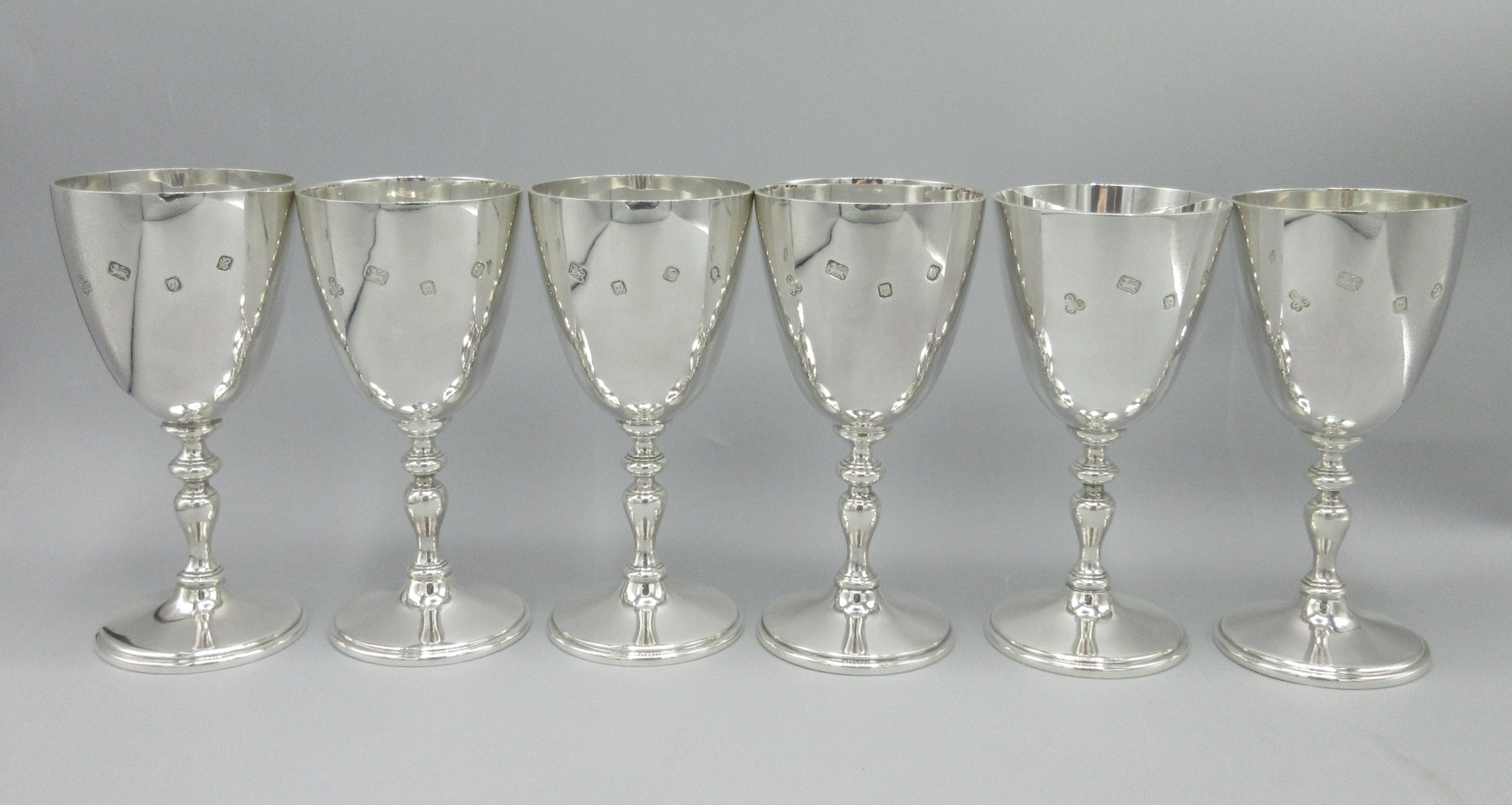 Six 20th century silver goblets with knobbed stems and circular bases ...