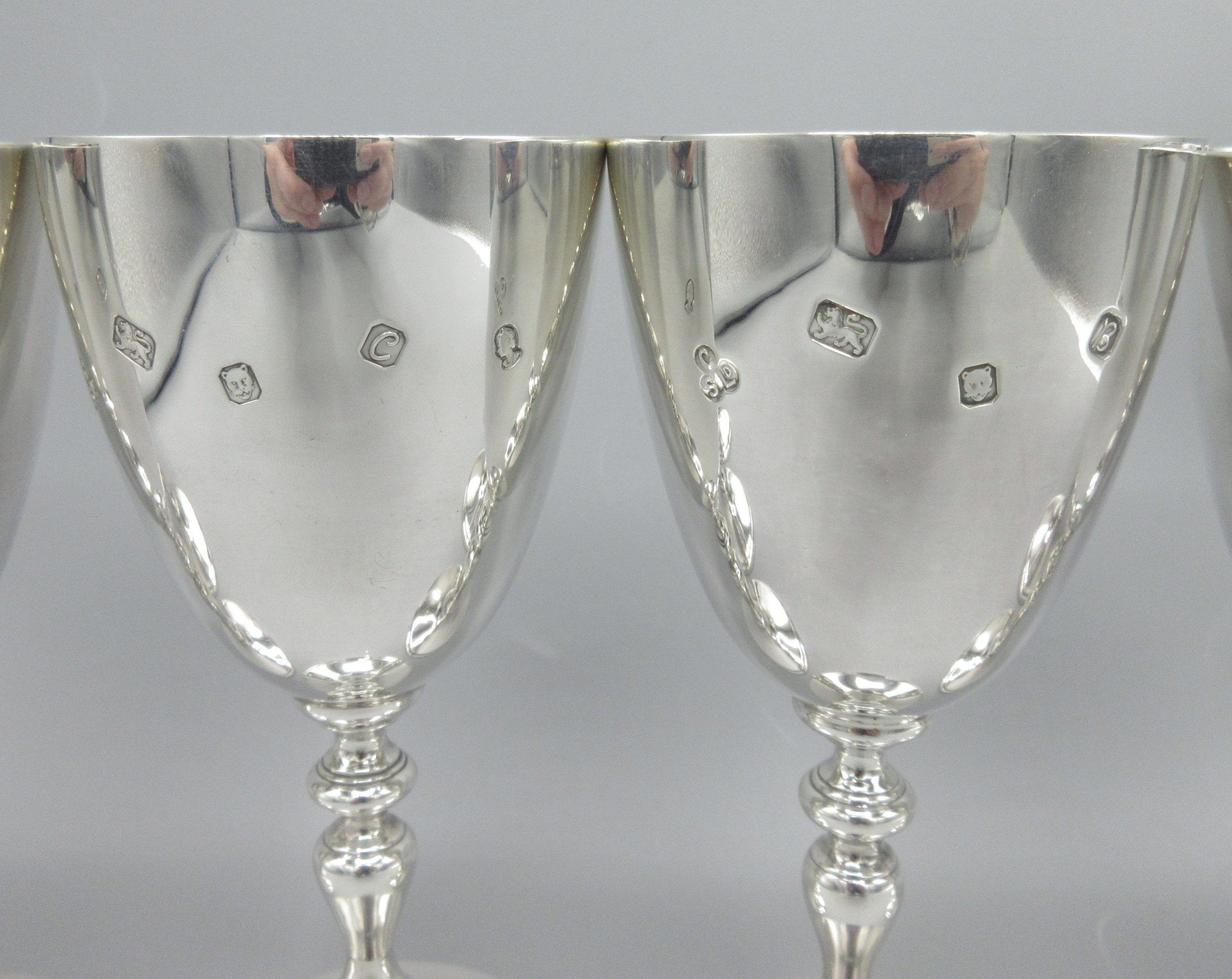 Six 20th century silver goblets with knobbed stems and circular bases ...