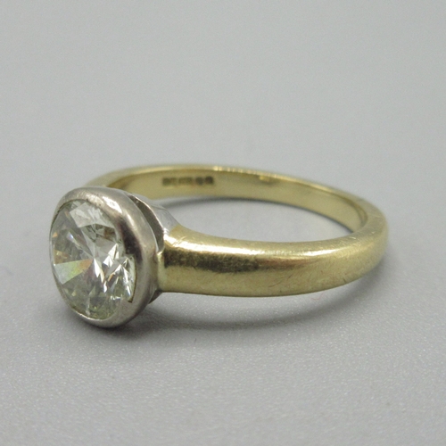 1011 - 18ct yellow gold diamond ring, approximately one carat diamond in bezel setting, stamped 750, size J... 