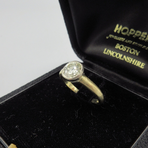1011 - 18ct yellow gold diamond ring, approximately one carat diamond in bezel setting, stamped 750, size J... 