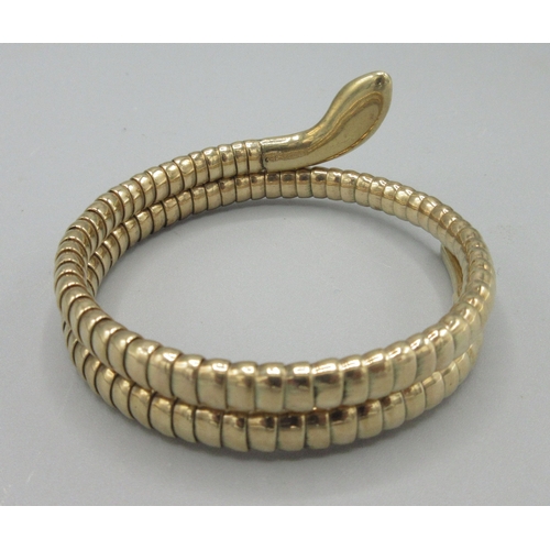 1021 - 9ct rose gold coiled snake bangle with ruby set eyes, stamped 375, 19.2g

Bradleys shipping £23.00 p... 