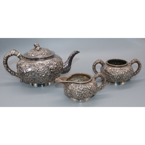 19th century Chinese export silver three-piece tea service, globular bodies relief decorated with chrysanthemum, stamped with character marks, Shanghai Luenwo, 33ozt (3)

Bradleys shipping £38.00 plus vat (UK Only)