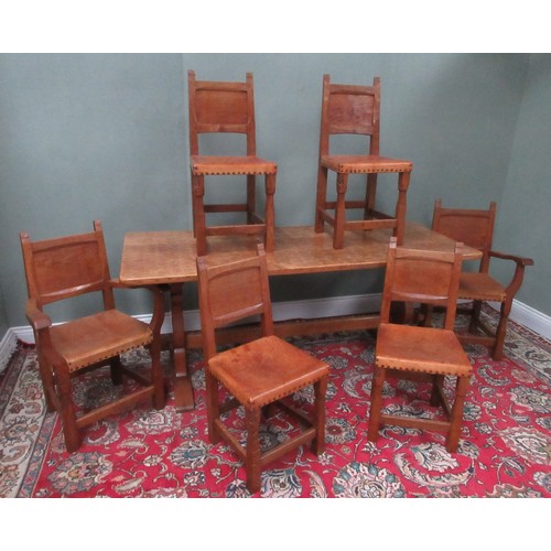 Thomas Gnomeman Whittaker of Littlebeck - an oak dining table, rectangular adzed top on adzed shaped end supports joined by a pegged stretcher, and a set of six (4+2) dining chairs, panel backs with brass nailed leather seats on square baluster supports with stretchers, carved with signature gnome, W183cm D76cm H75cm (7)

This table was used for the inaugural meeting of what would later become The Beatrix Potter Society, held in Teddington, Middlesex in 1980. With receipt for table, letter apologising for the delay and swing tag  

Bradleys shipping POA https://www.bradleys.ltd/quotation-request-form