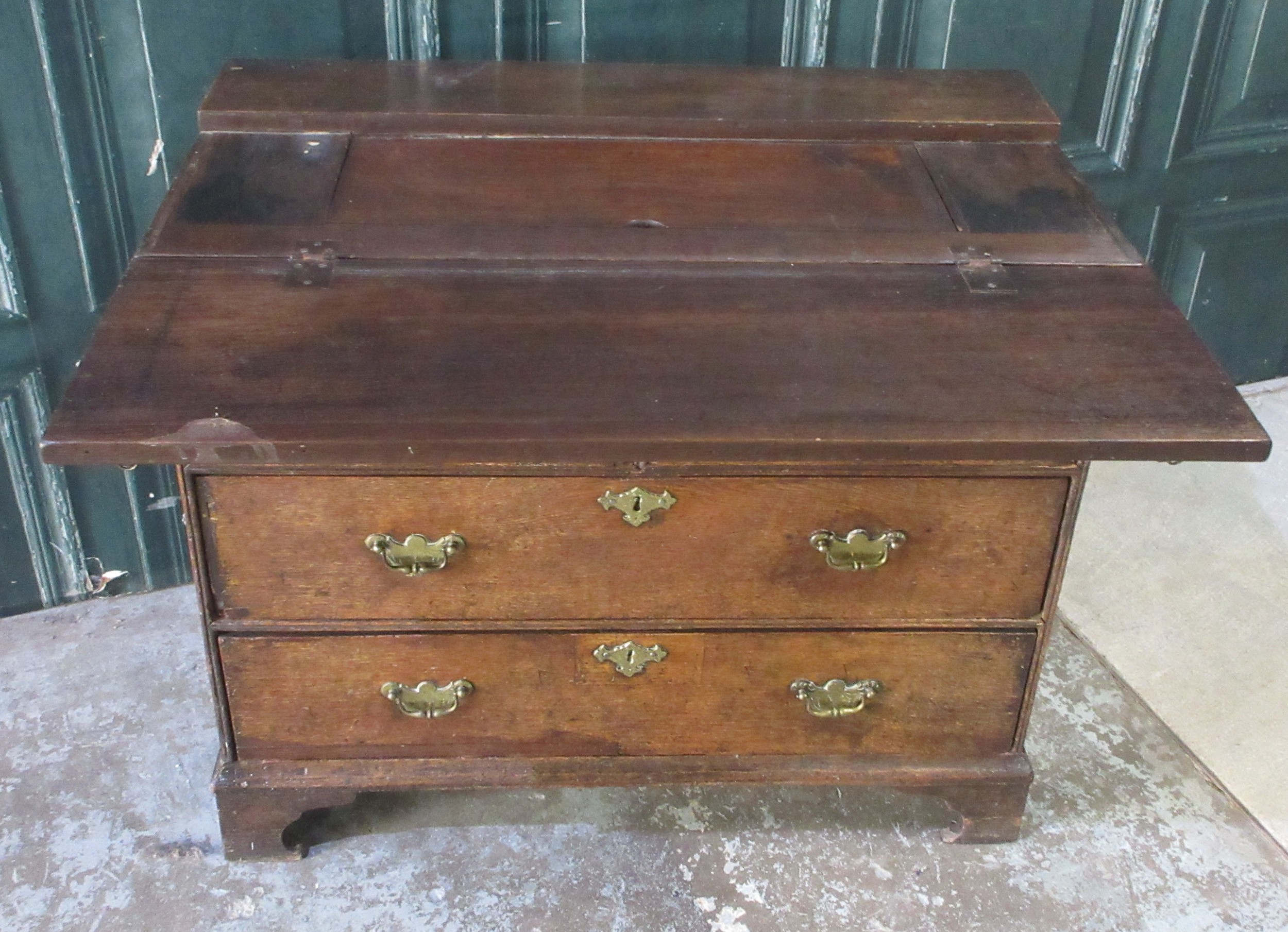 George 111 oak writing chest, folding top revealing a well above two ...